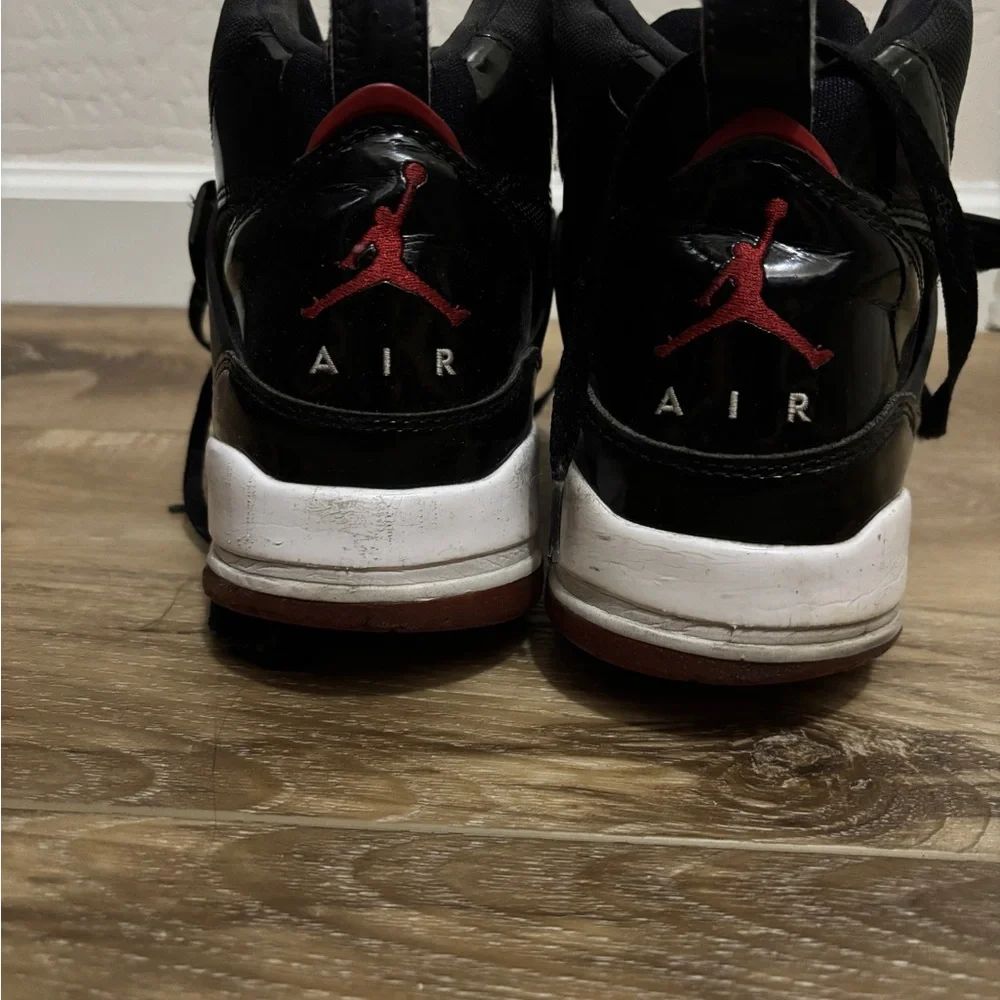 Jordan Black Athletic Sneakers with Red Accent